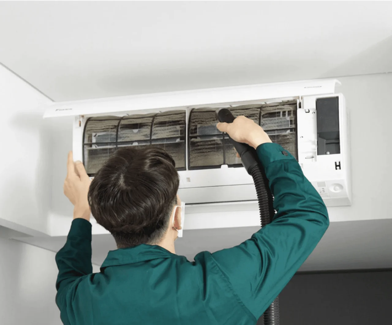 Aircon specialist diagnosing outdoor unit
