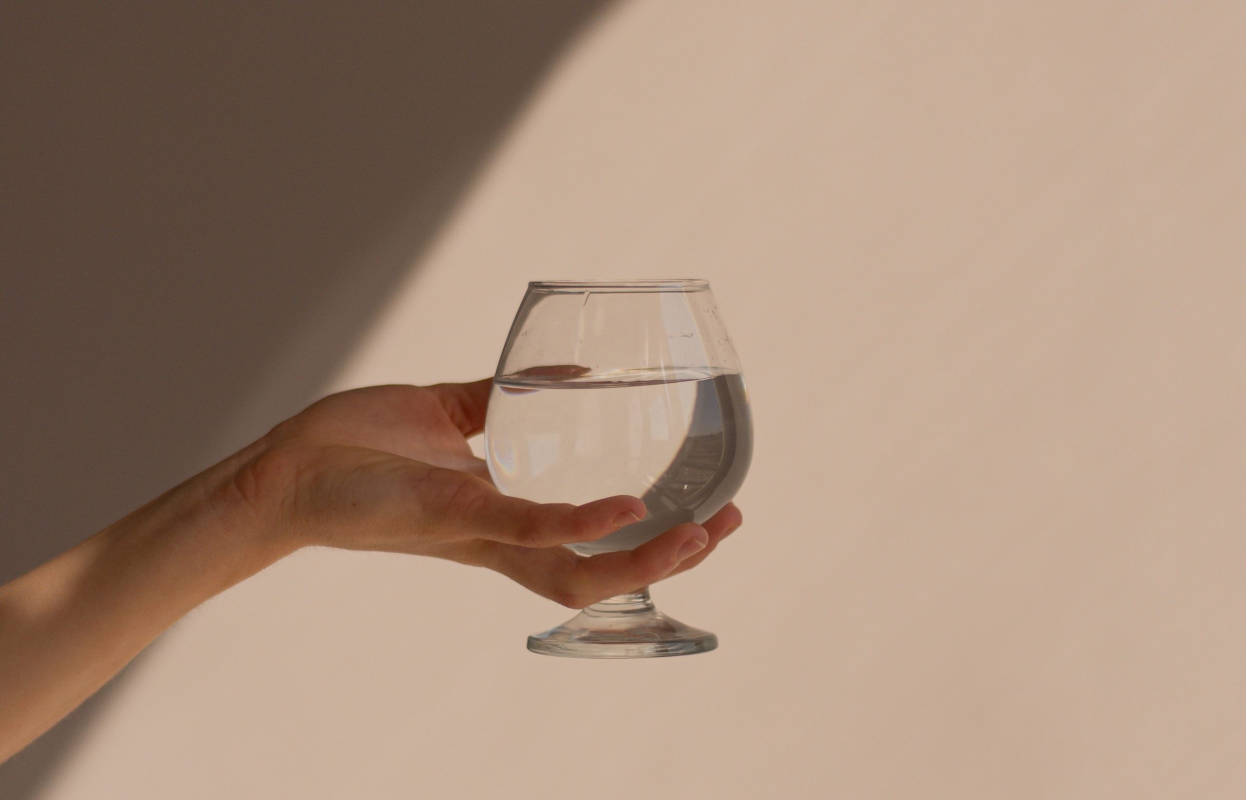 part-time maid - hand holding transparent cup