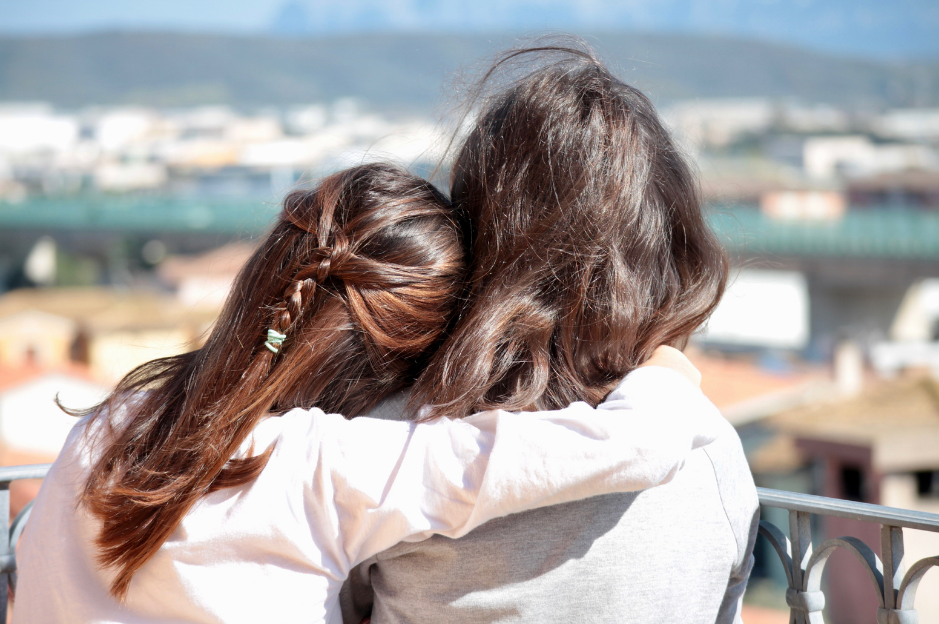 two people shoulder to shoulder