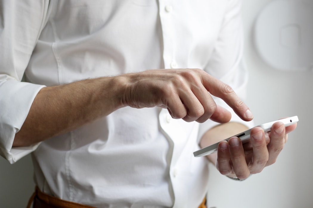 guy tapping his handphone