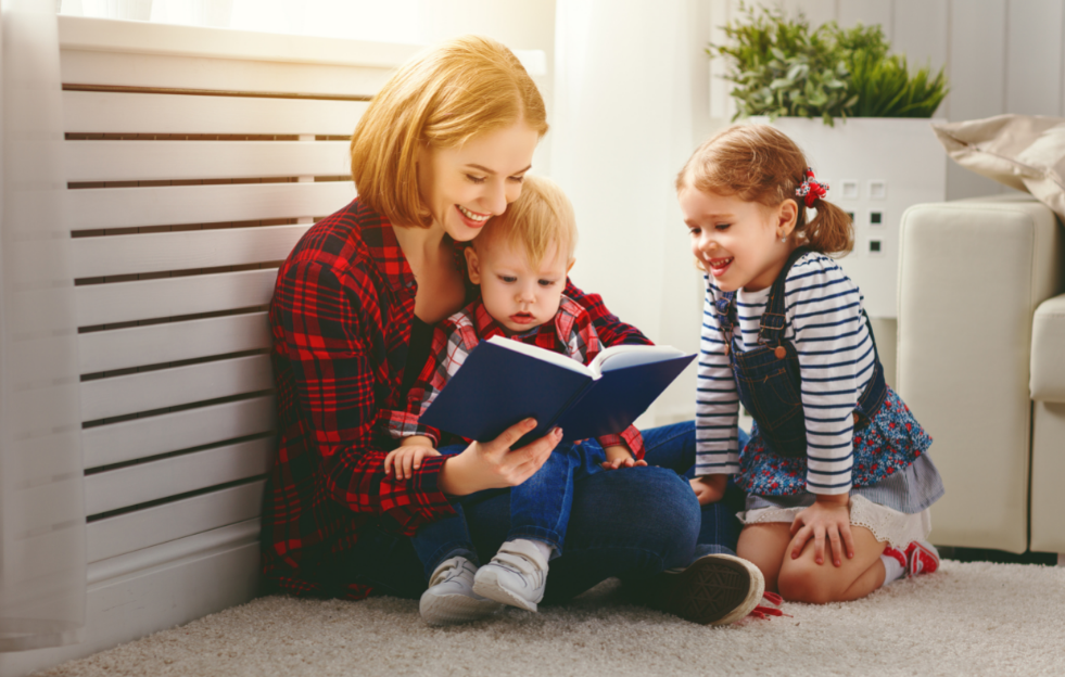 cleaning habit for kids - mother reading a book with kids