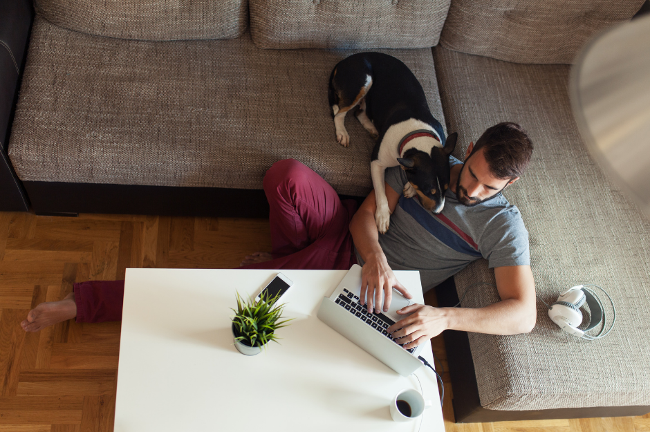 man working from home with his dog